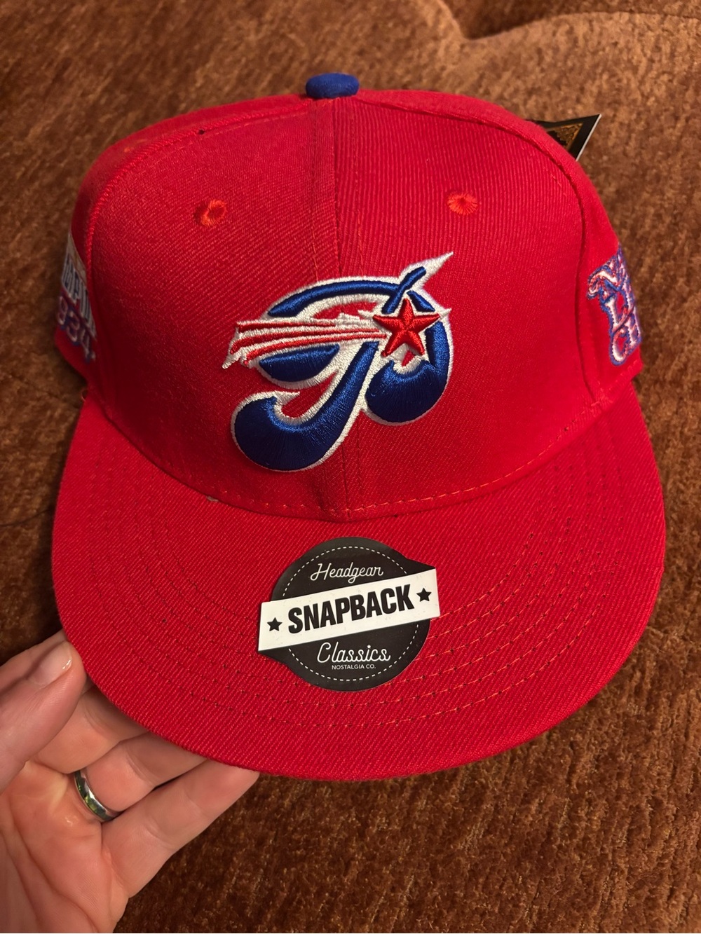 Red Snapback Baseball Hat with Blue Embroidered Logo